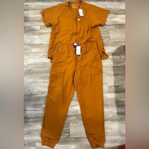 New with tags Figs gold scrubs set size large